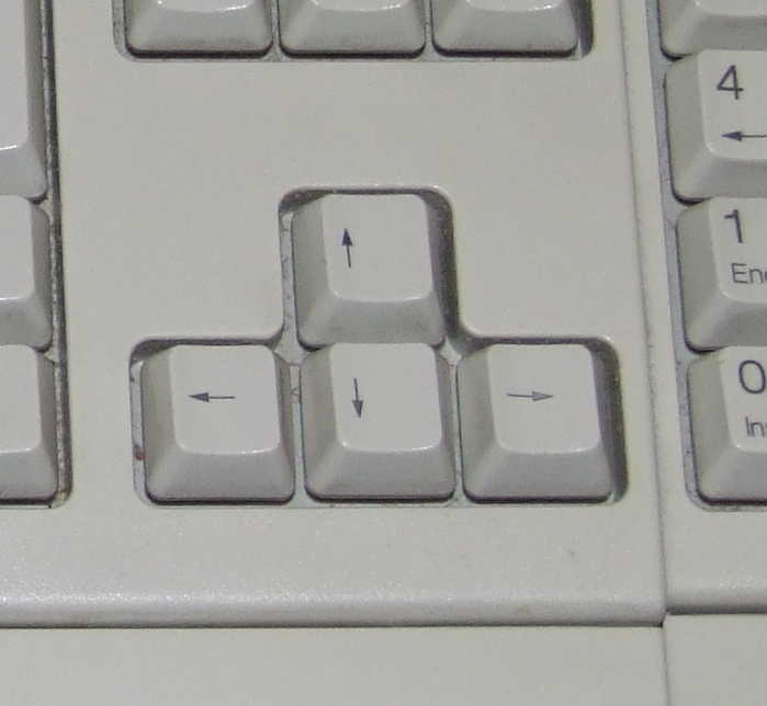 Foto das teclas direcionais do teclado.