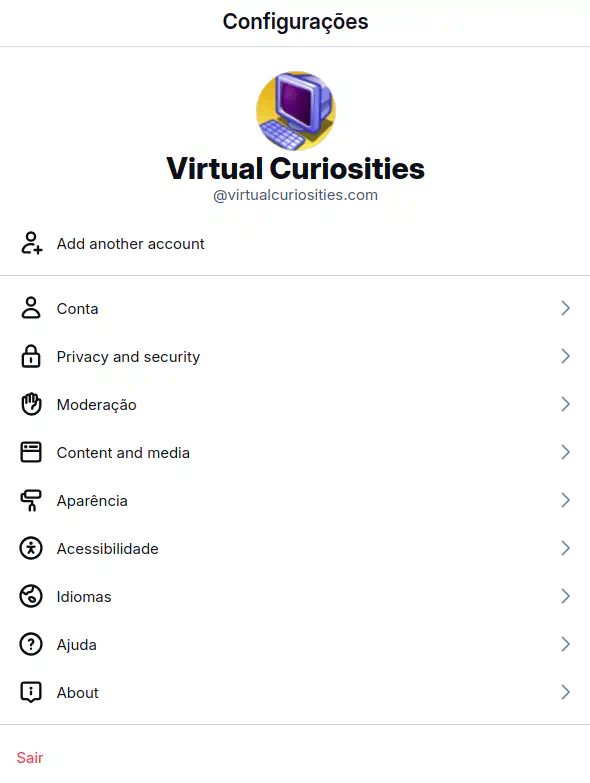 Uma página com o título "Configurações" exibindo o avatar do usuário virtualcuriosities.com. Opções: "Add another account," "Conta," "Privacy and security," "Moderação," "Content and media," Aparência, Accessiblidade, Idiomas, Ajuda, About, e Sair.